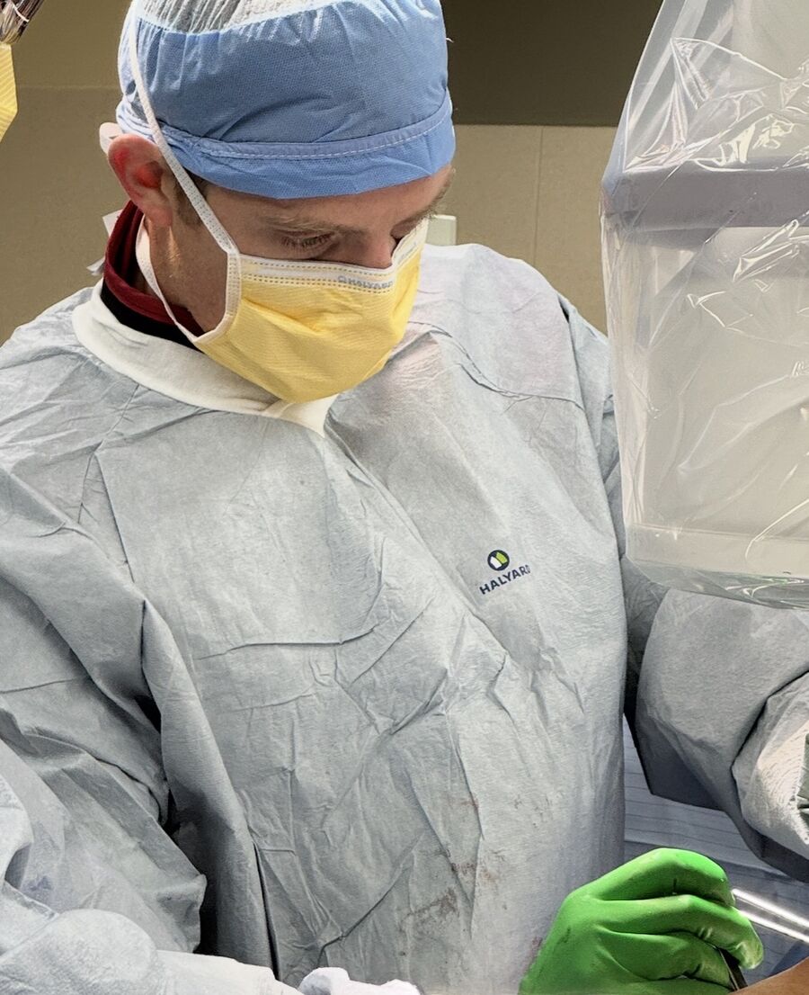 Dr. Mitchell focused during a surgical procedure